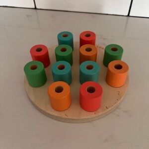 Lovevery wooden stacking peg board with pegs